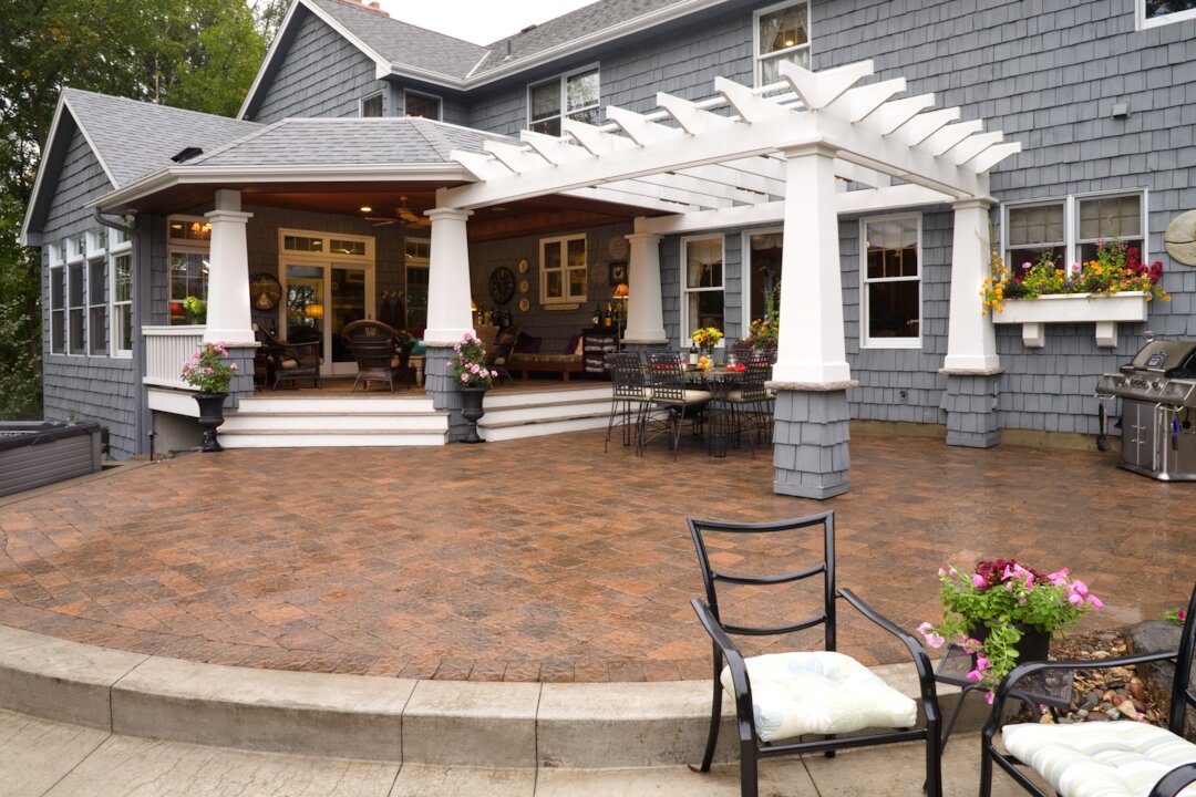 Spacious patio with pergola and outdoor seating area.