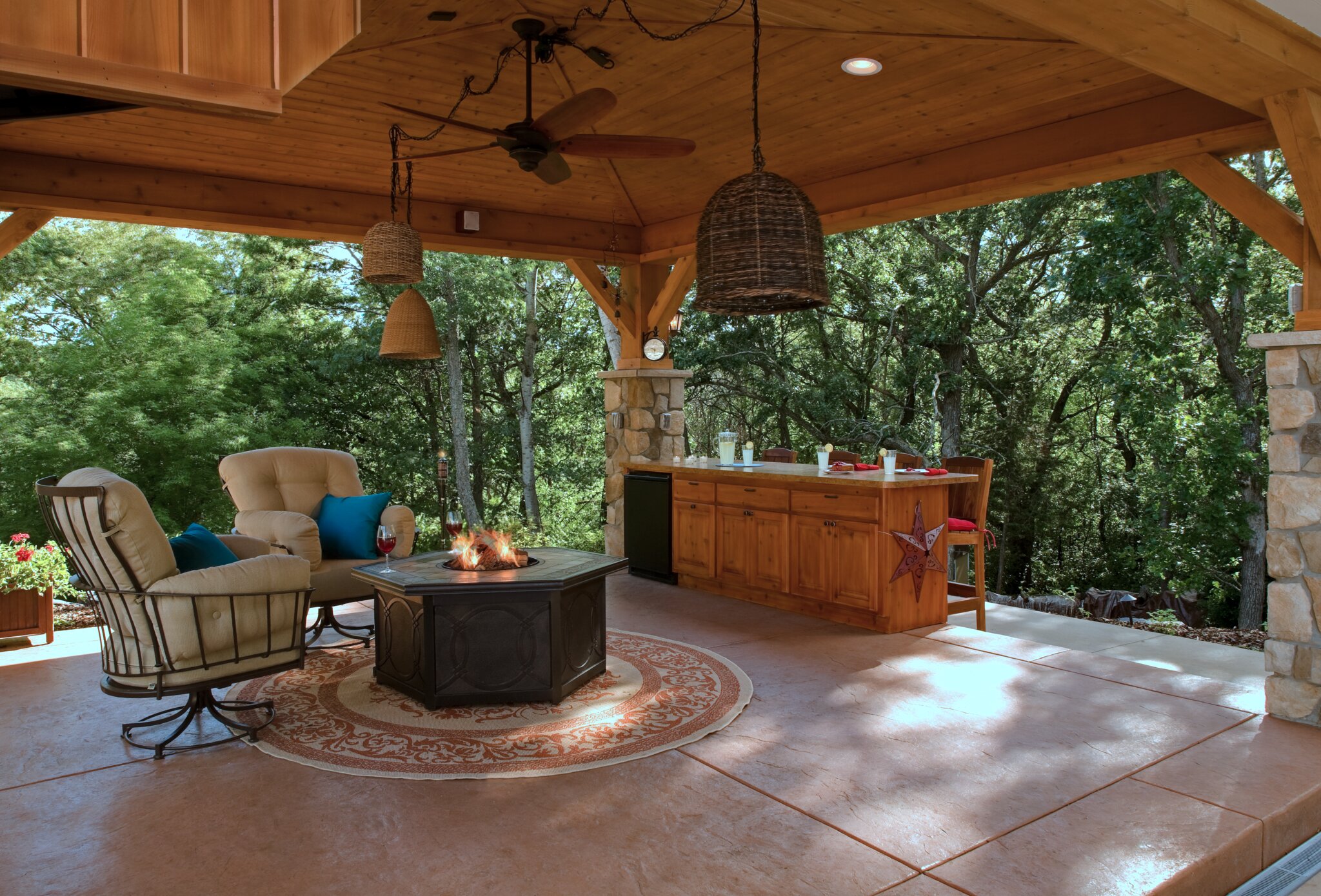 Outdoor patio with fire pit and seating area.