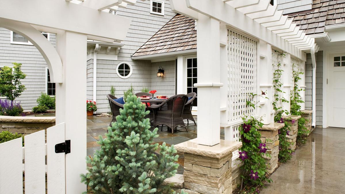 Cozy patio with wicker furniture and pergola