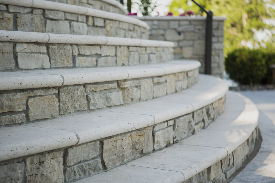 Curved stone steps in sunlight.