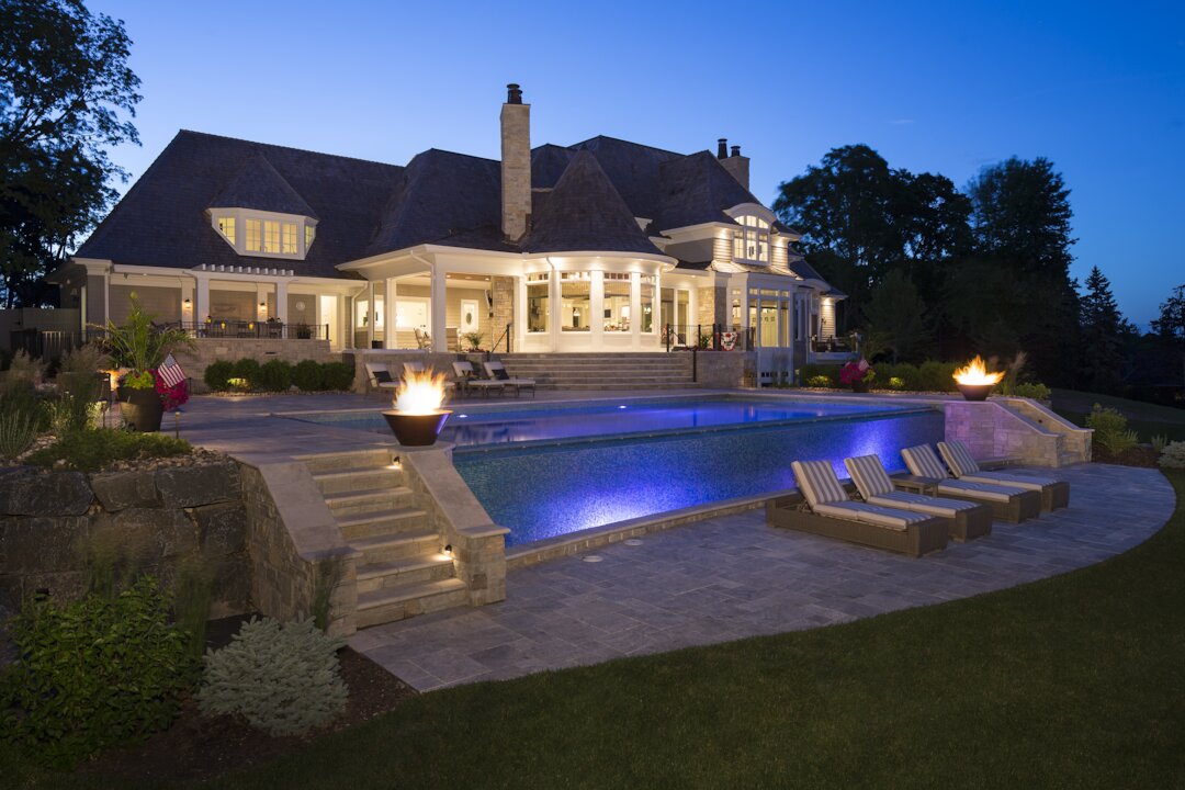 Luxurious house with pool and evening lighting