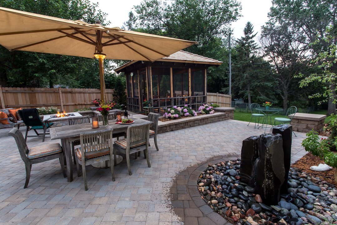 Backyard patio with dining area and gazebo