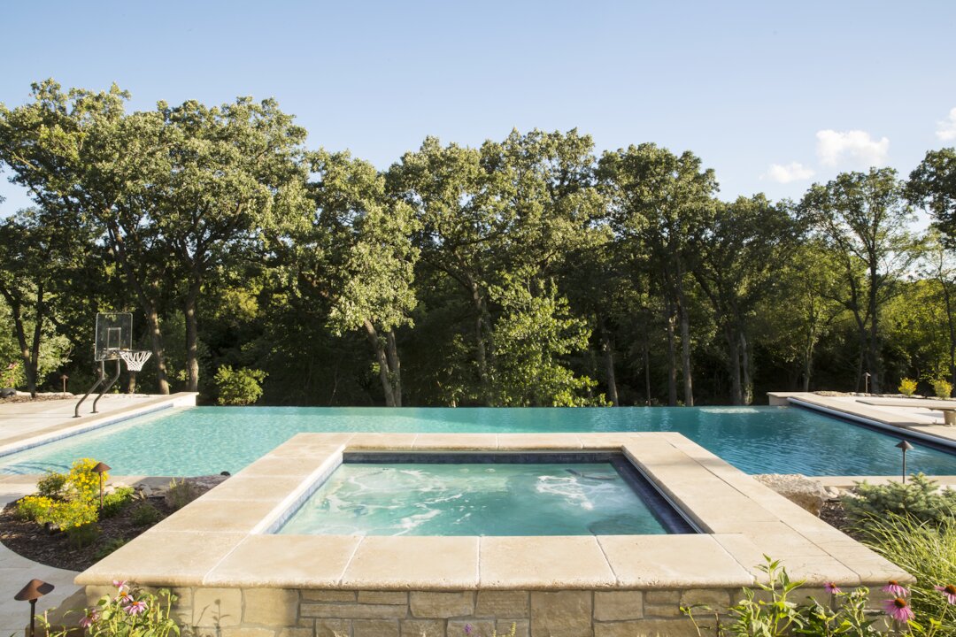 Luxury pool with jacuzzi and scenic view