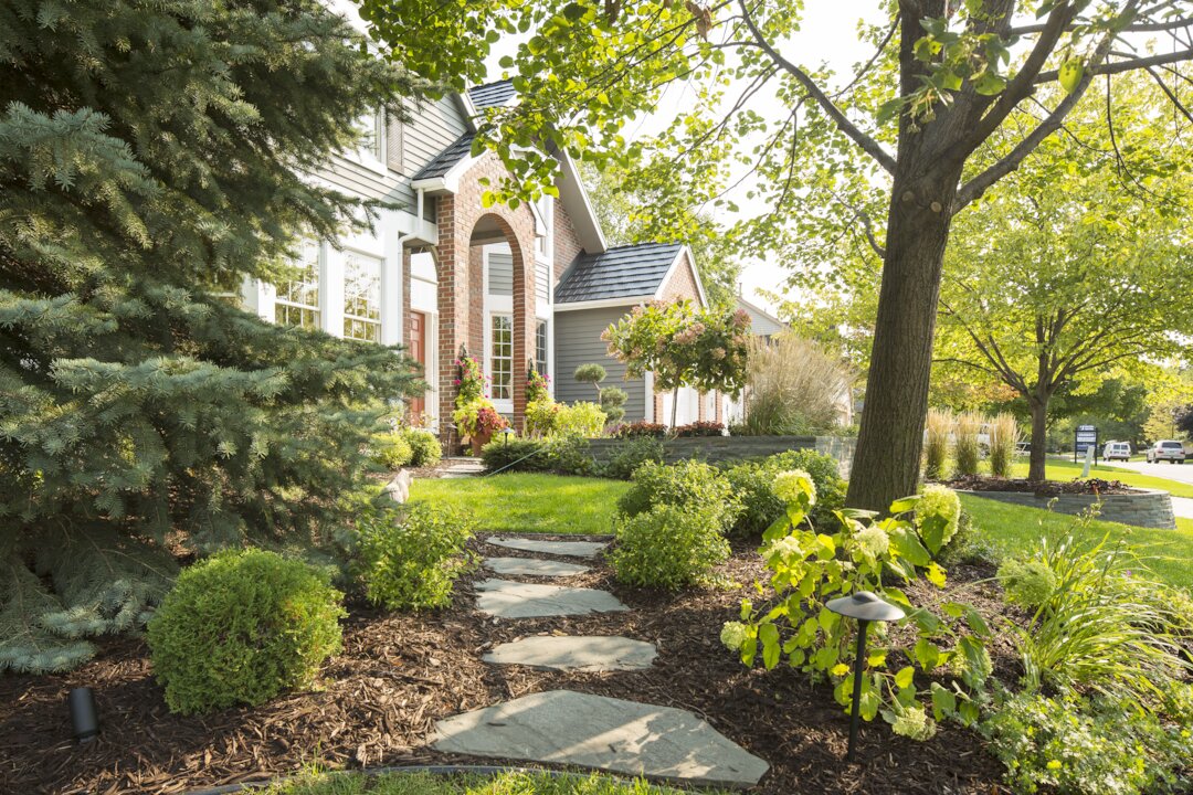 Beautiful landscaped front yard with pathway.