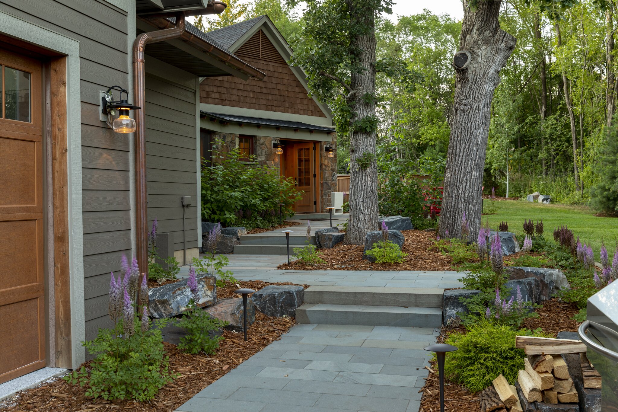 Beautiful garden pathway with trees and flowers.