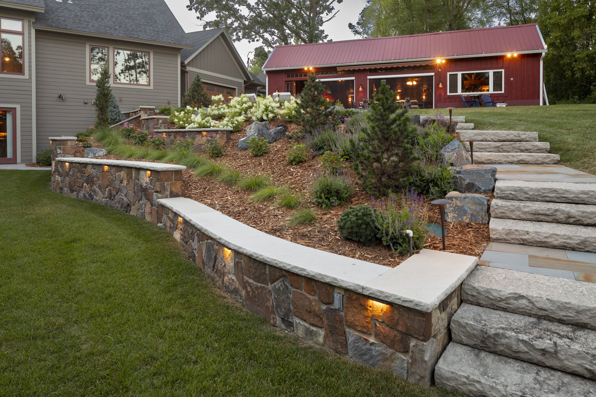 Elegant house with landscaped garden and stone steps.