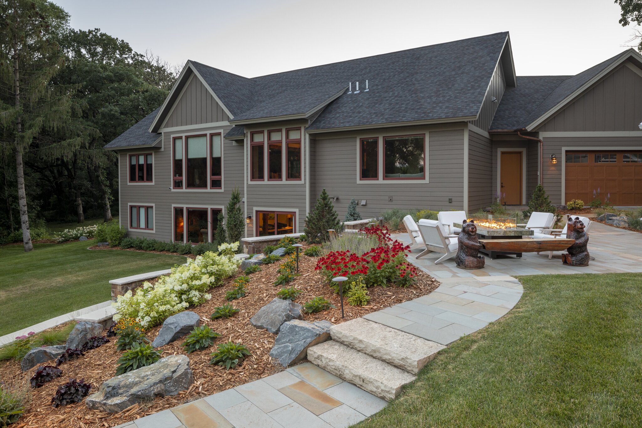 Modern house with landscaped garden and patio area.