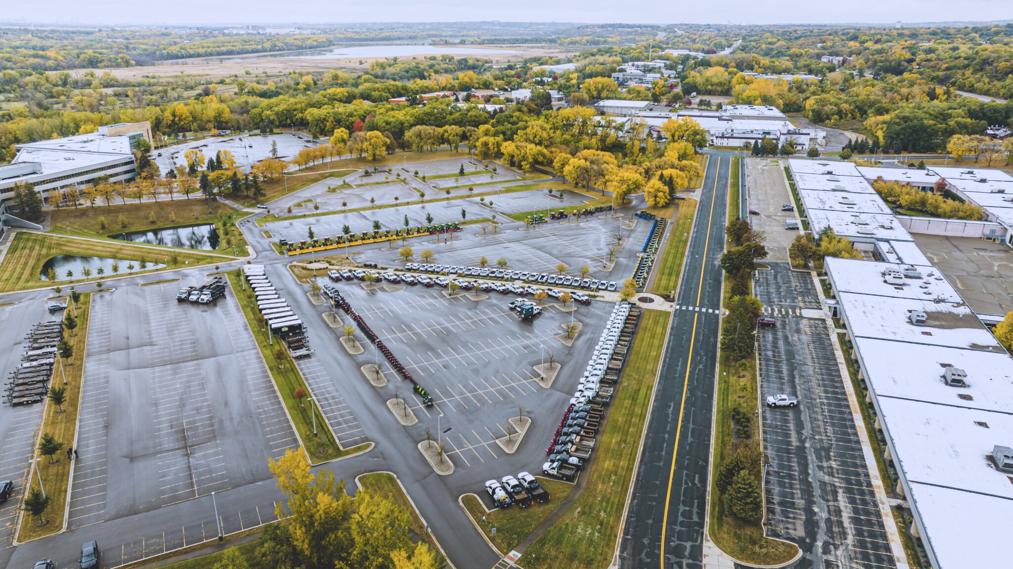 Aerial view of parking lot and surrounding buildings.