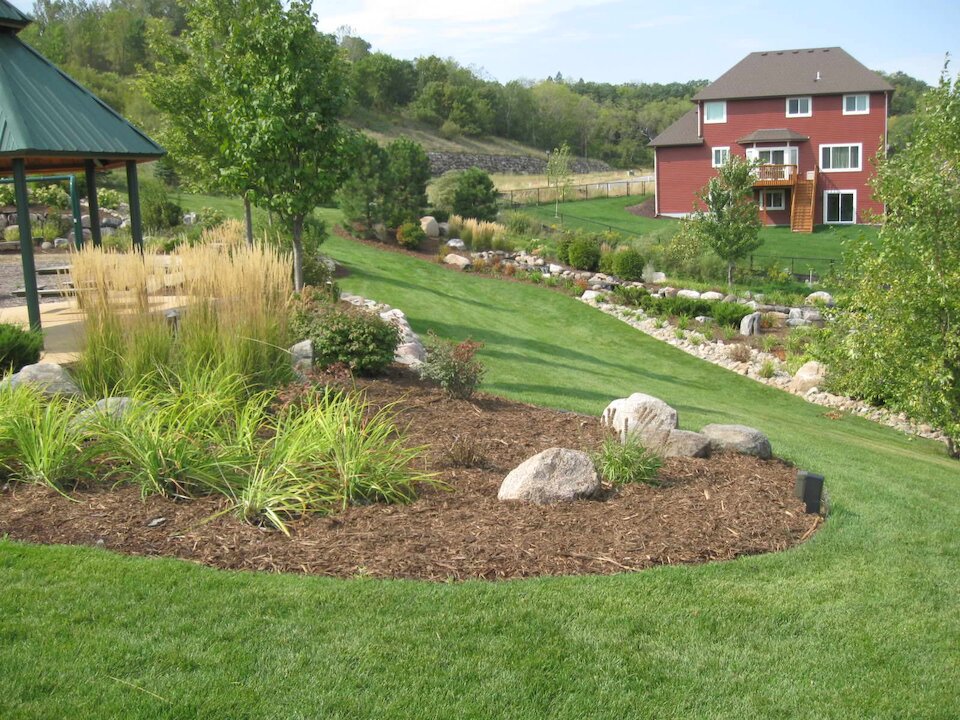 Serene backyard with garden and gazebo.