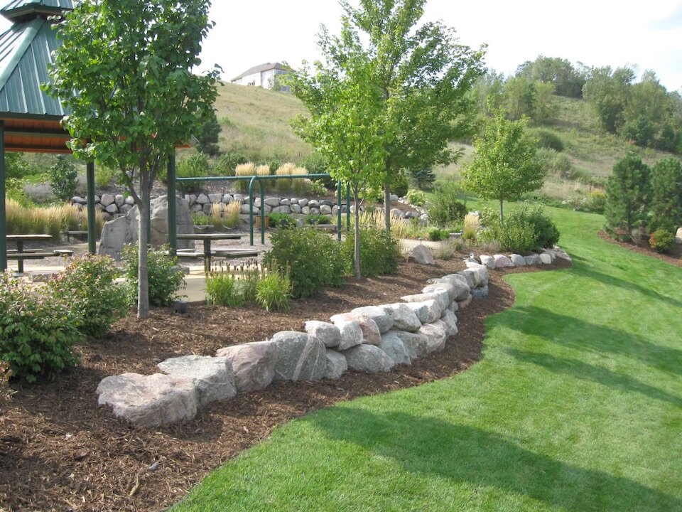 Park with stone-bordered landscaped garden