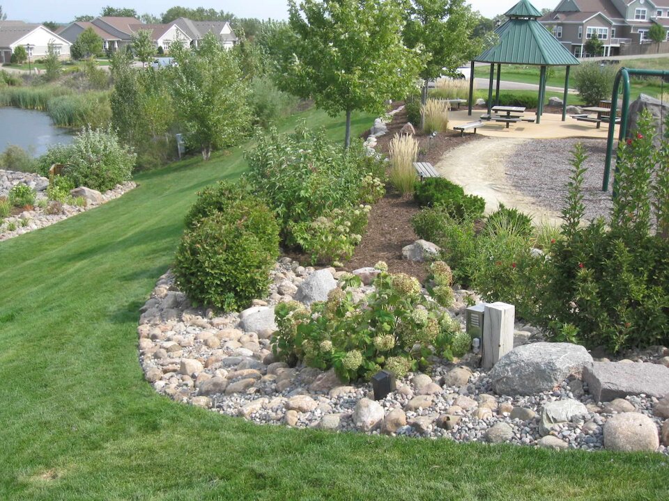 Community park with gazebo and landscaped garden.