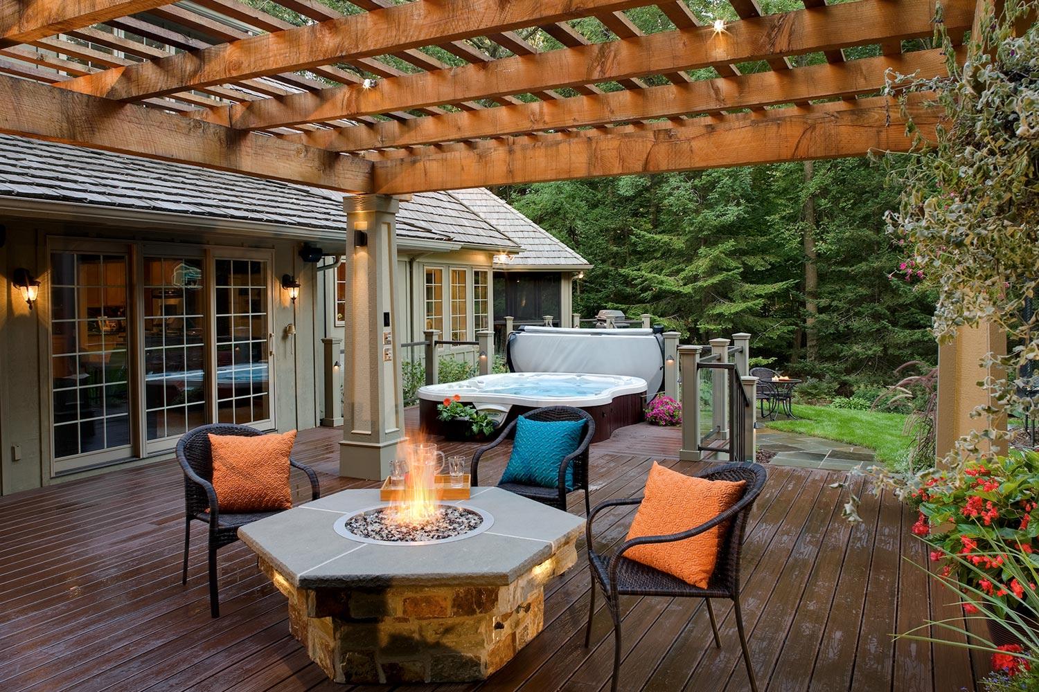 Backyard deck with firepit and hot tub.