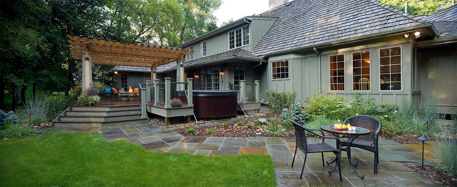 Cozy backyard with pergola and patio seating.