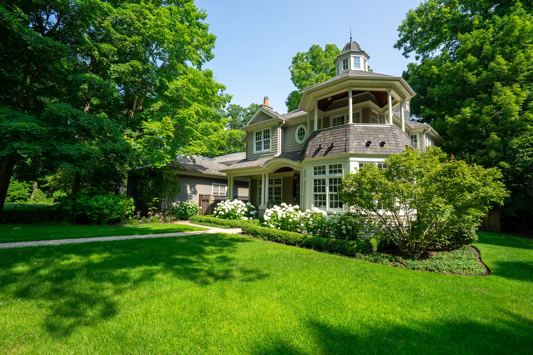 Charming house with garden and trees.