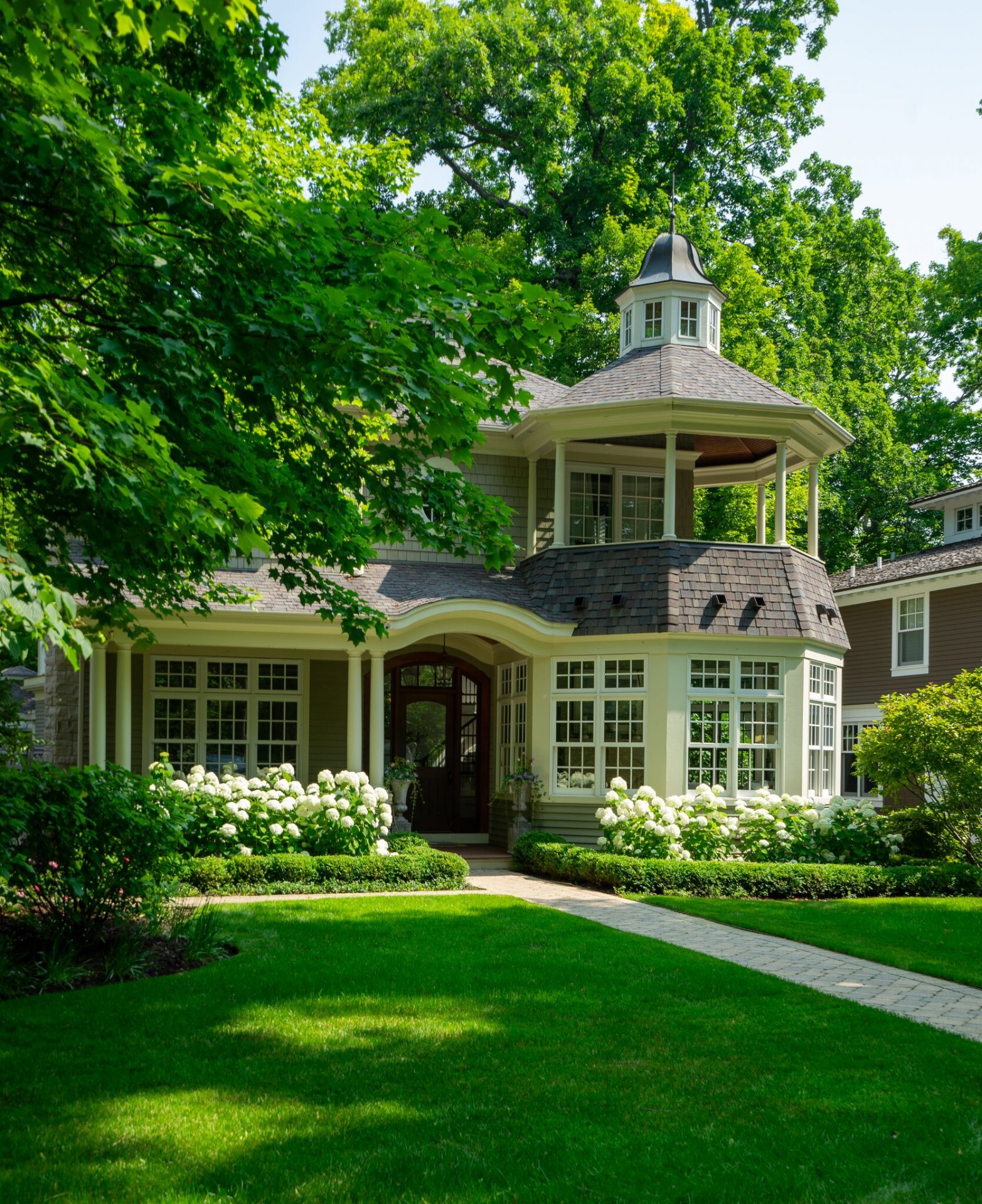 Charming house with garden and tower in summer.