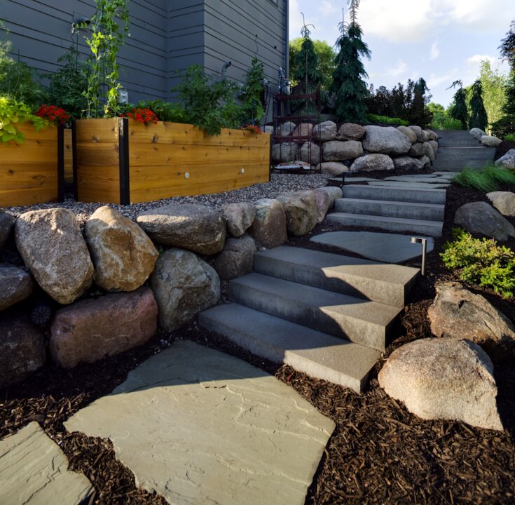 Stone steps and garden with large rocks