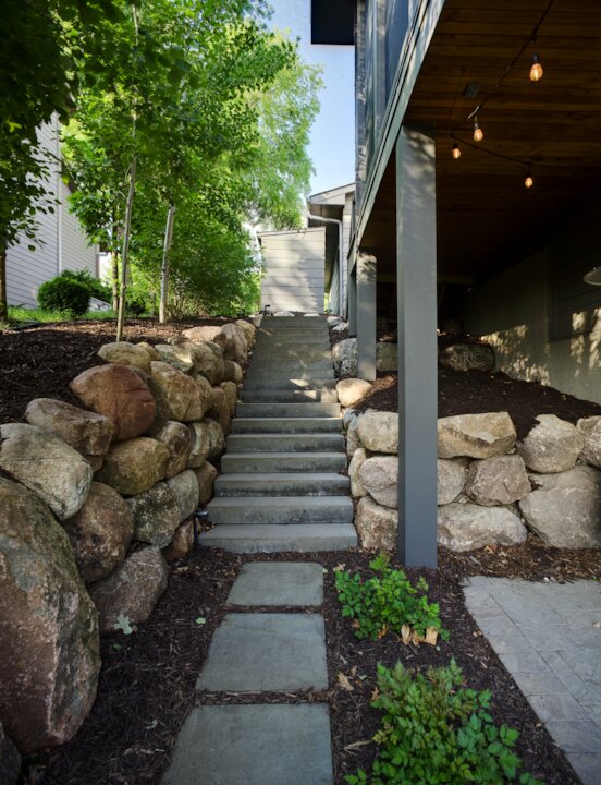 Stone steps and garden in a backyard.