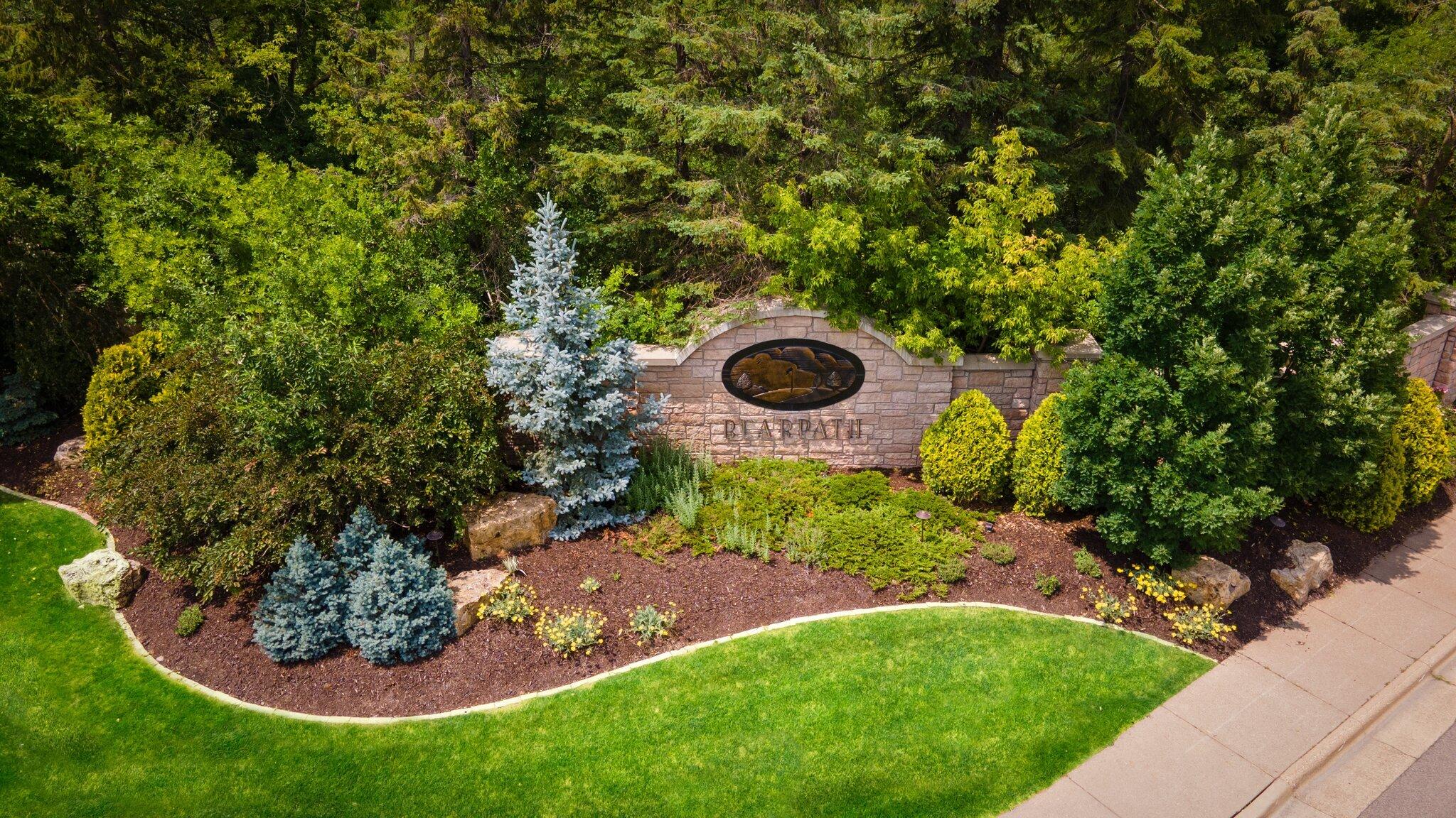 Bearpath neighborhood entrance with trees and landscaping.