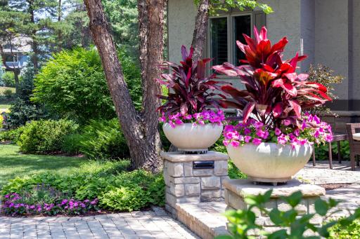 Lush garden with decorative stone planters