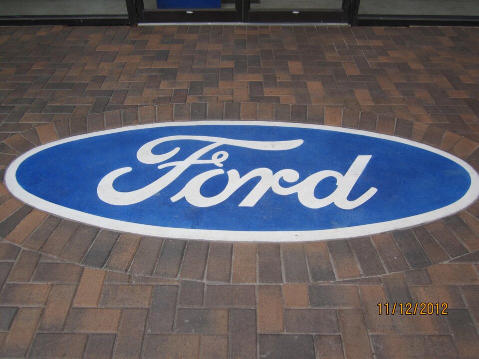 Ford logo on blue oval background.
