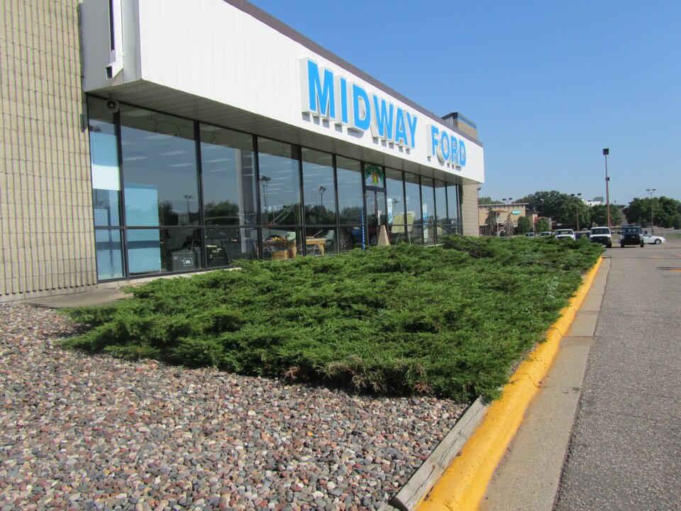 Midway Ford dealership exterior view with parking lot.