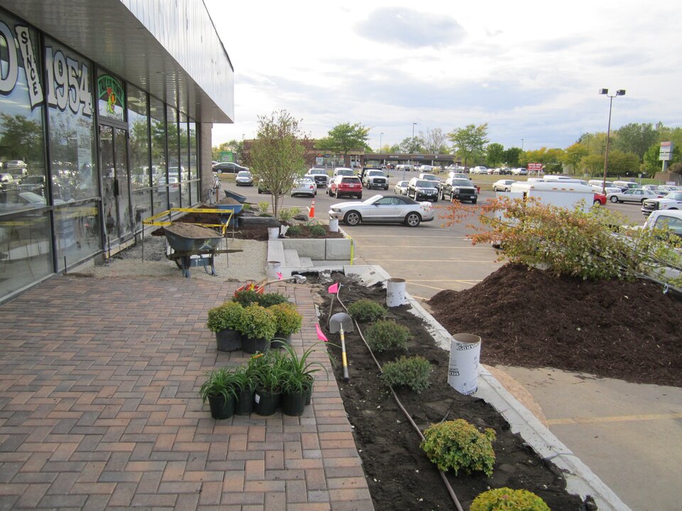 Commercial building with landscaping work in progress.