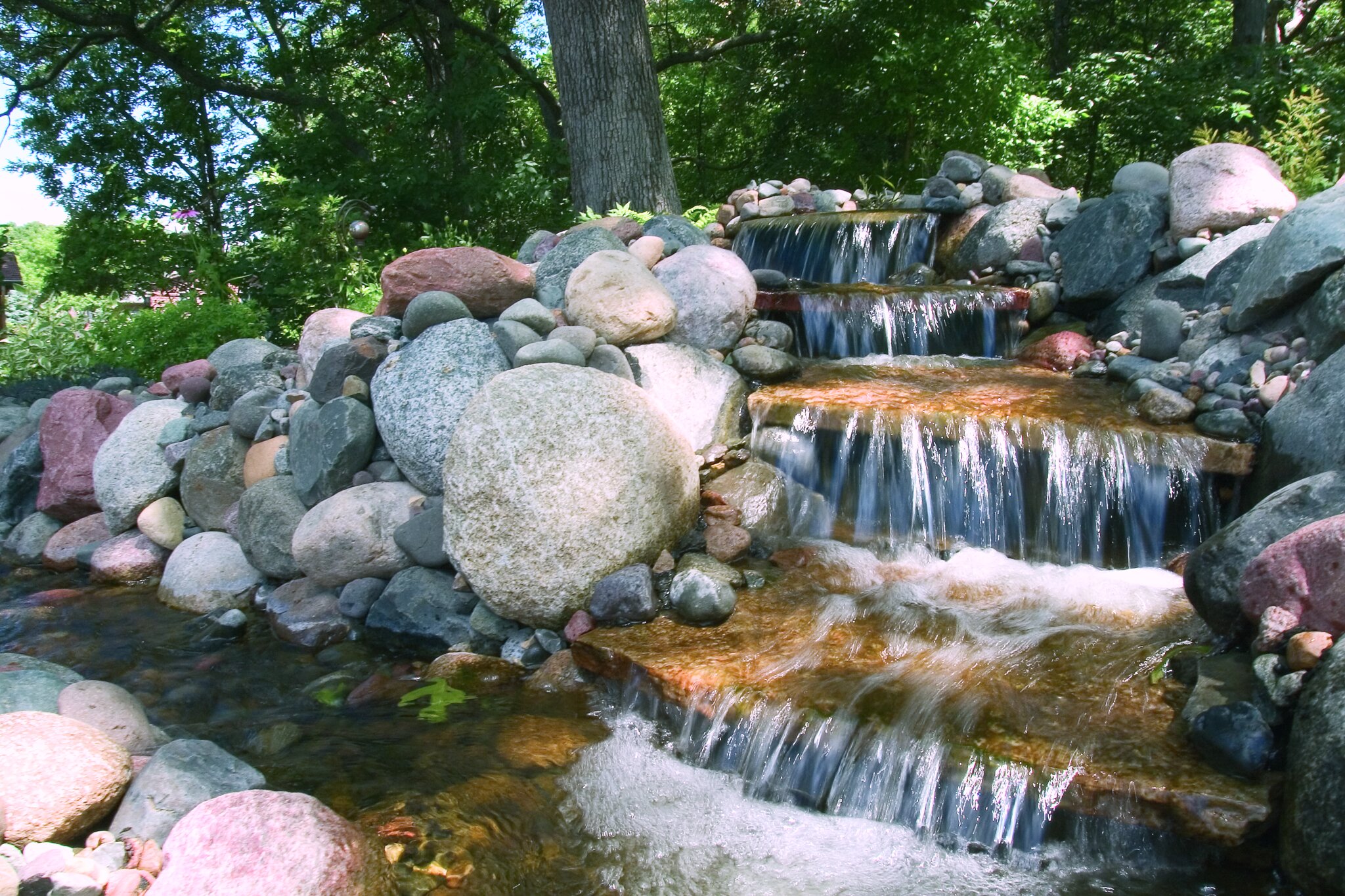 Small rock waterfall in forest setting