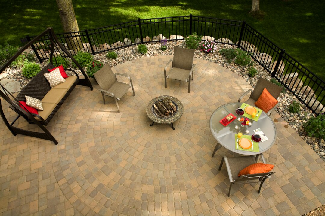 Outdoor patio with seating and fire pit.