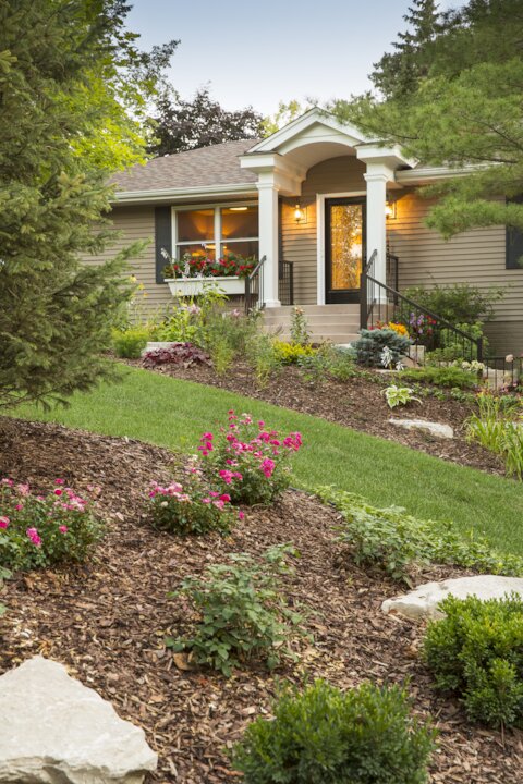Beautifully landscaped suburban house entrance.