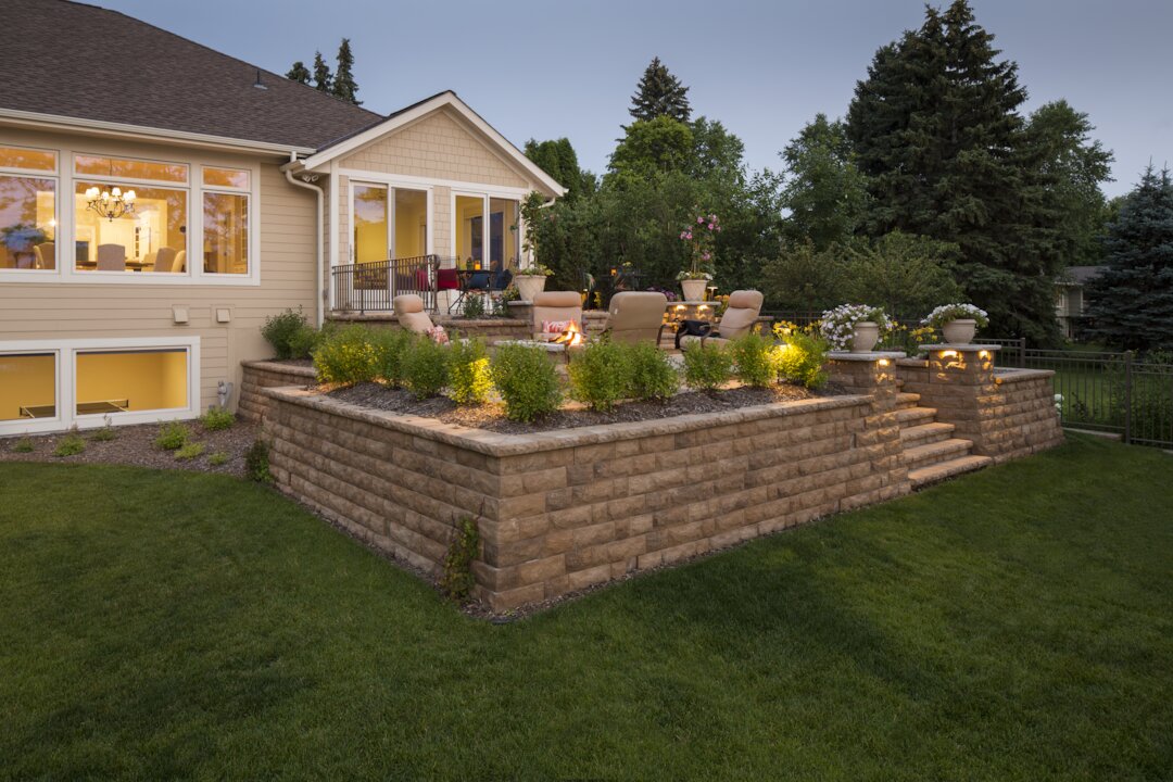 Cozy backyard patio with fire pit and seating.