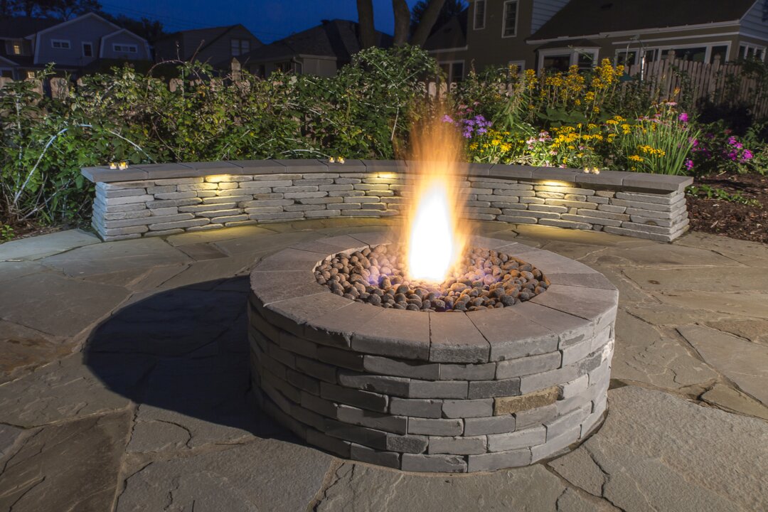 Outdoor stone fire pit with seating area