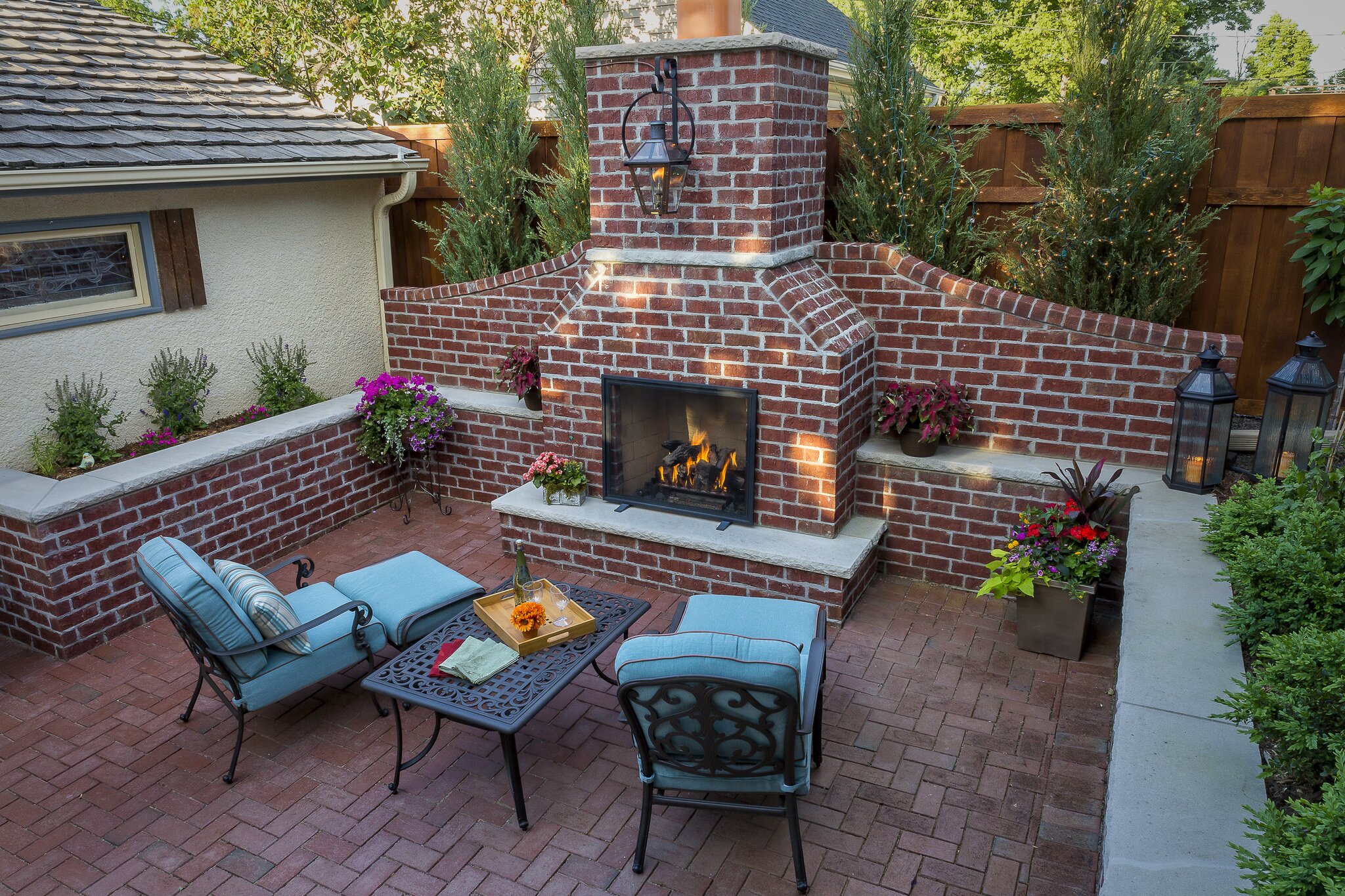 Cozy patio with fireplace and seating area.