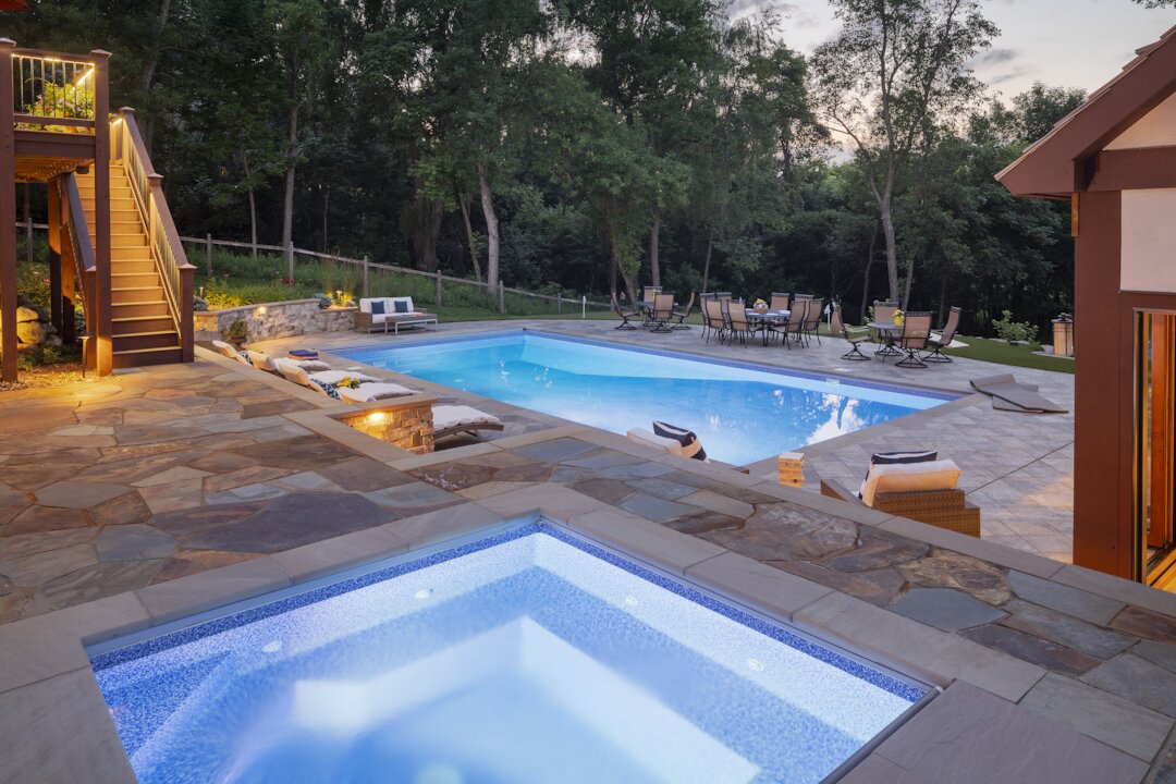 Luxurious backyard with pool and hot tub