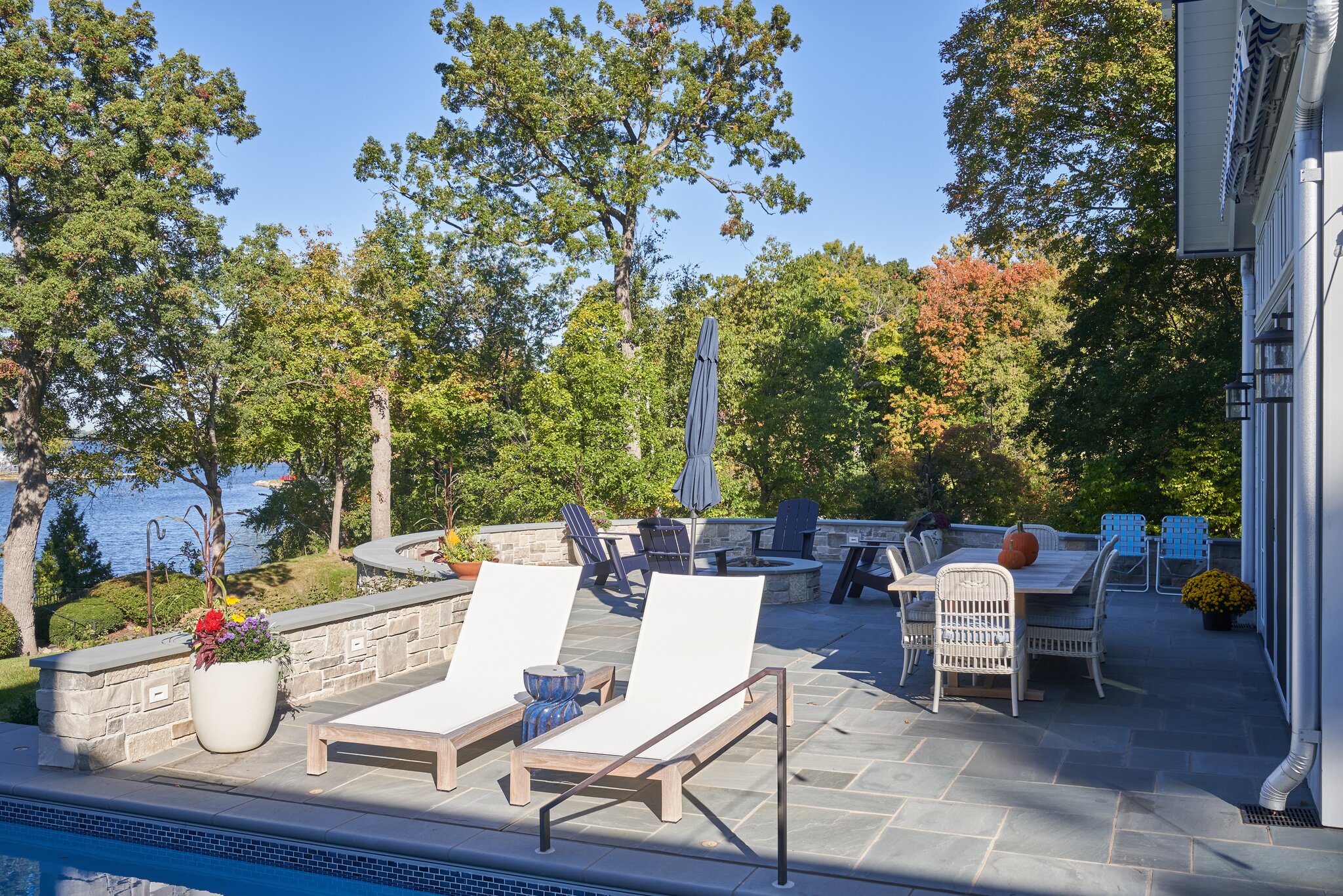 Outdoor patio with lounge chairs and dining table.
