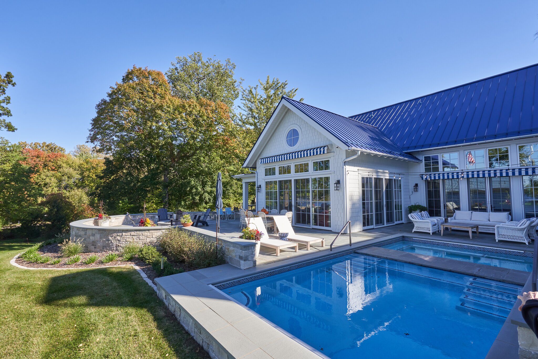 Modern house with pool and patio area.