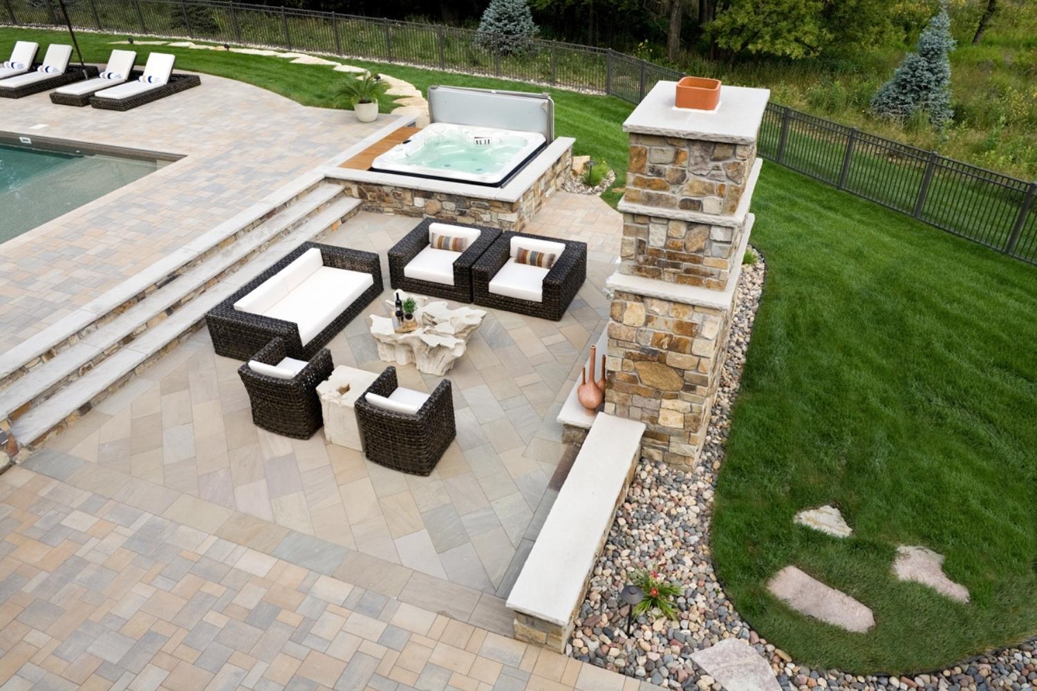 Outdoor patio with seating and jacuzzi