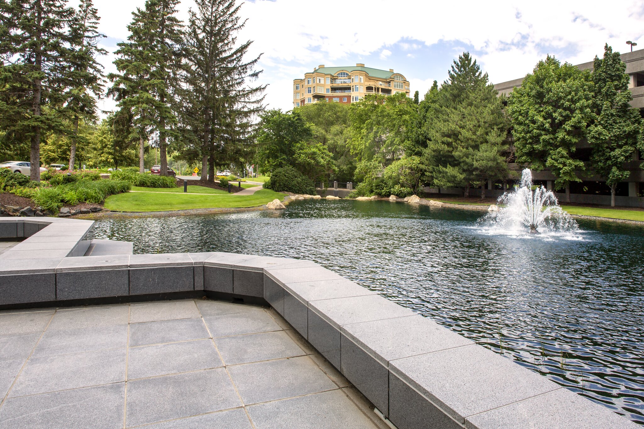Serene park with pond and fountain view
