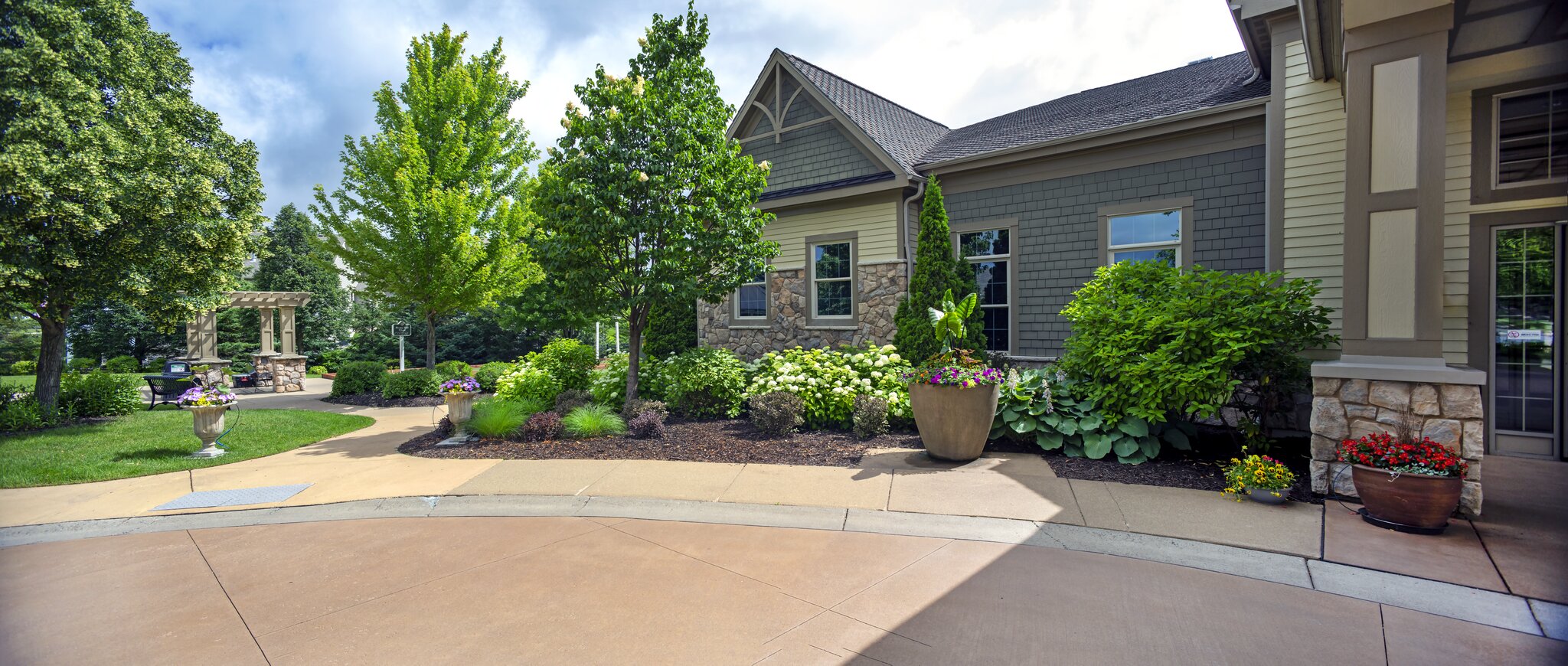 Lush garden beside modern building entrance