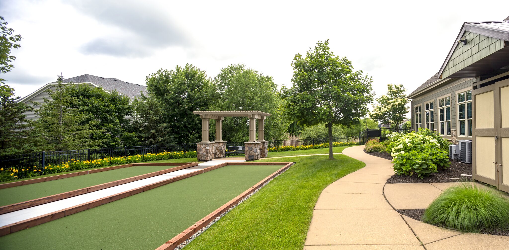 Tranquil backyard with garden and bocce court.