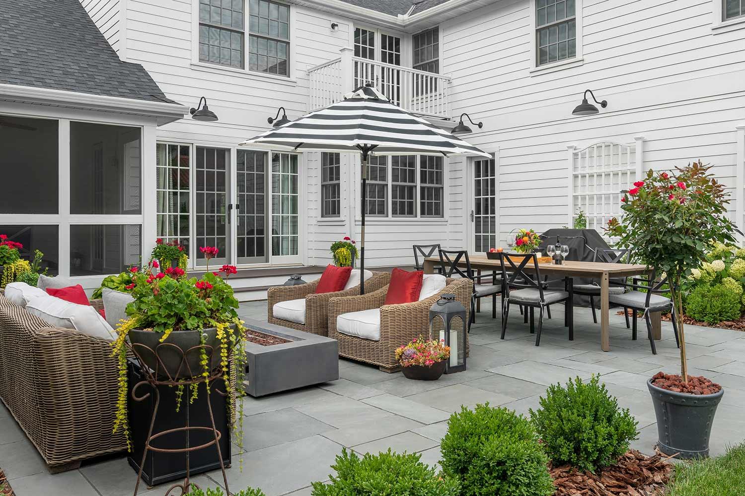 Outdoor patio with furniture and plants.