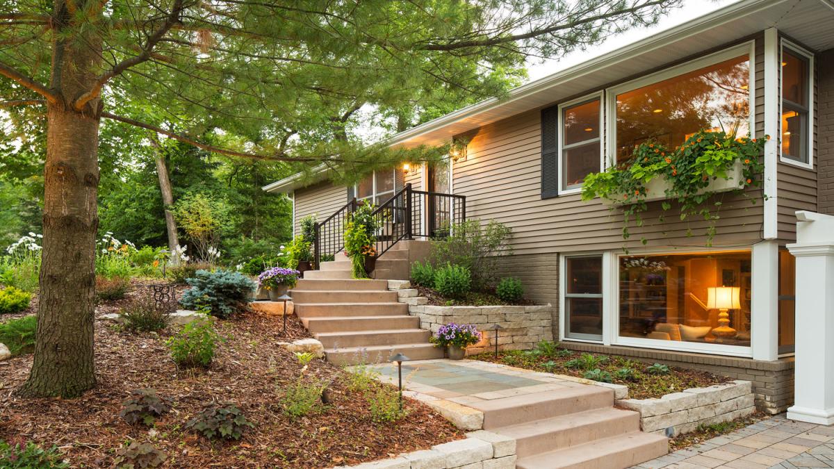 Suburban home with lush garden landscape.