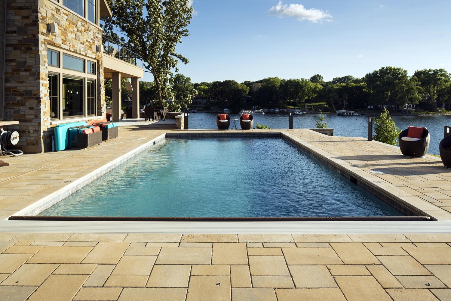 Luxury pool overlooking scenic lake view.