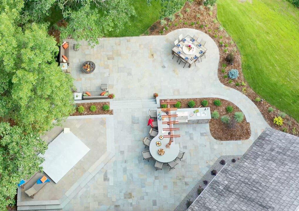 Aerial view of landscaped outdoor patio with seating.