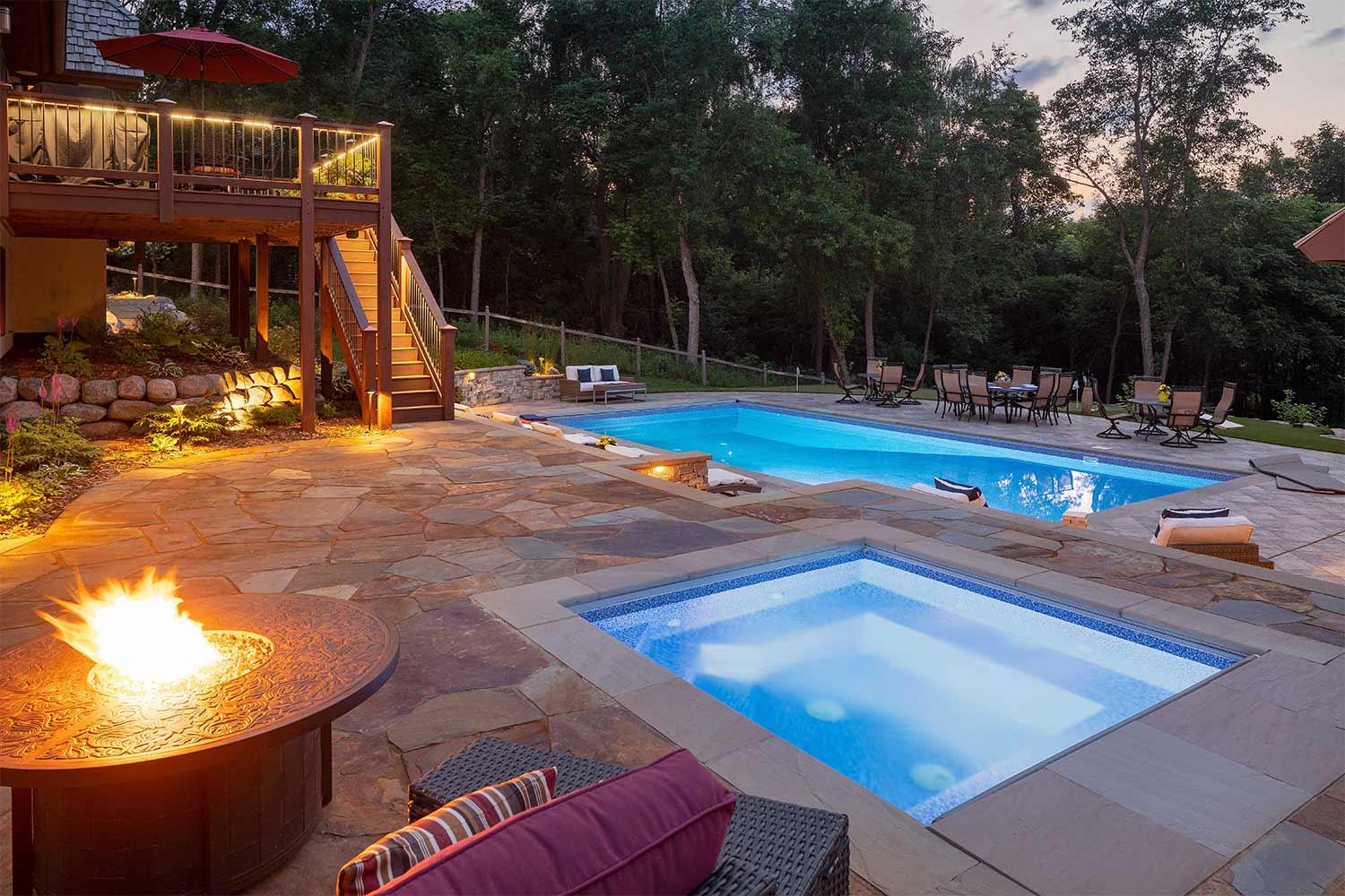 Luxury backyard with pool, fire pit, and deck