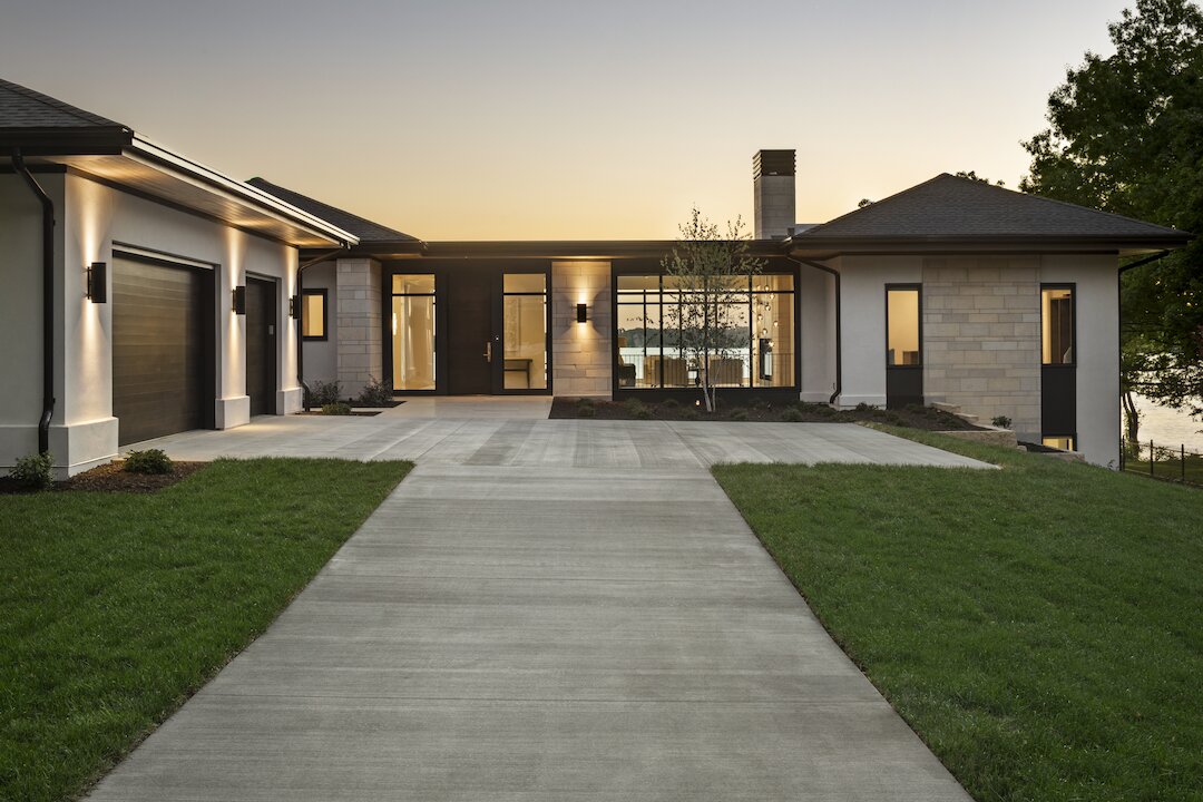 Modern house exterior with sunset lighting.