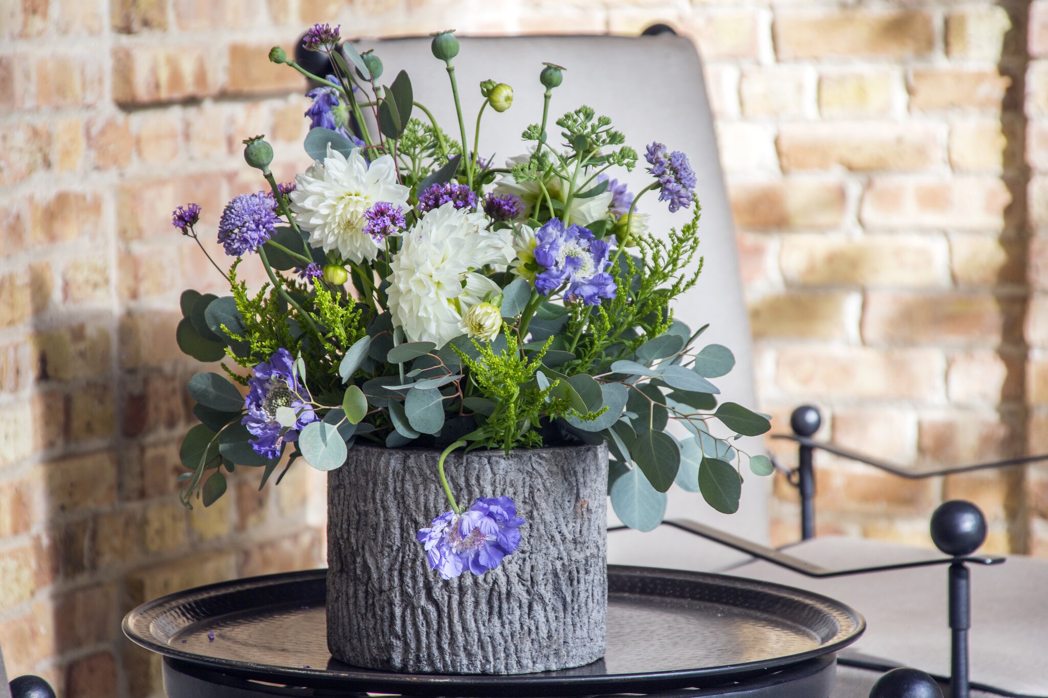 Colorful floral arrangement in a textured vase