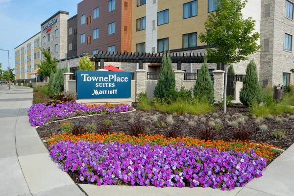 TownePlace Suites hotel entrance with colorful flowers.