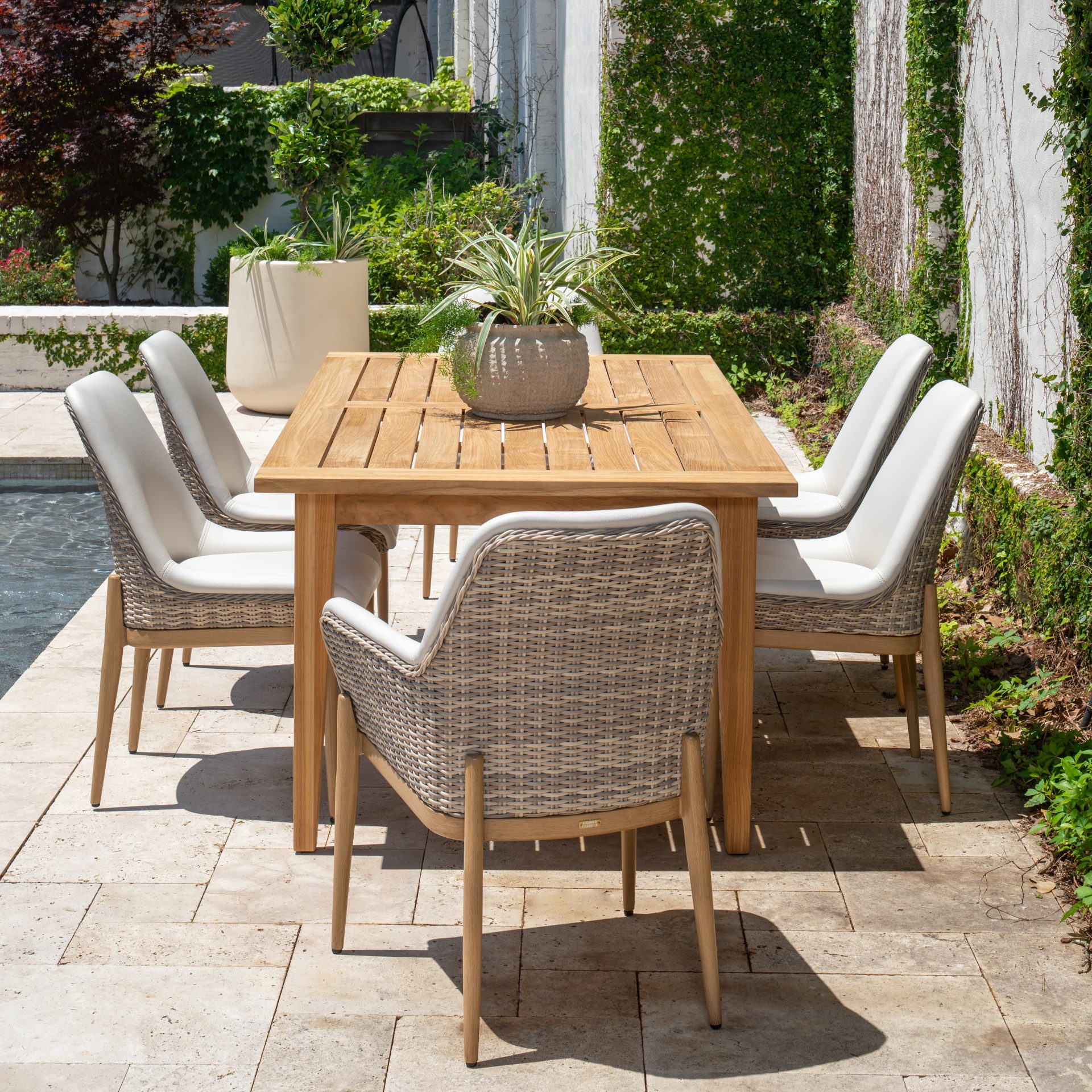 table and chairs near pool