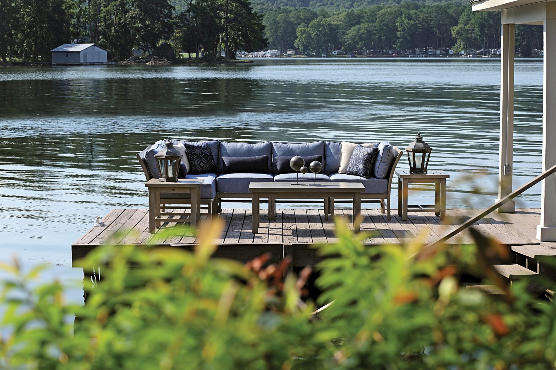 Outdoor patio sofa on lakeside deck