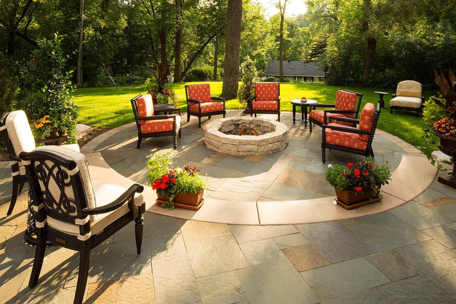 Cozy outdoor patio with fire pit and seating.